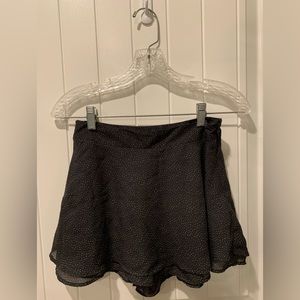 Black skirt with small white polka dots